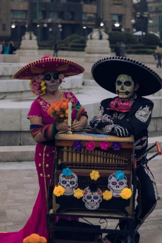 a man and woman that are sitting on a carriage