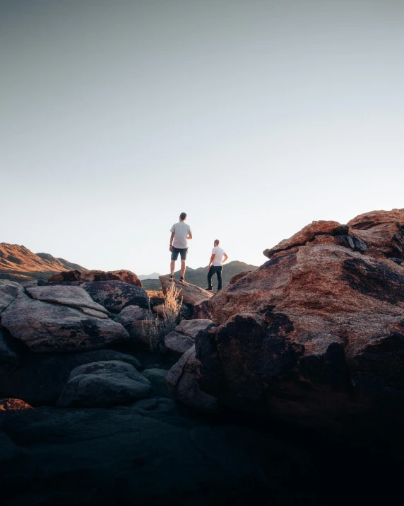 two people on a rock with no one in the view