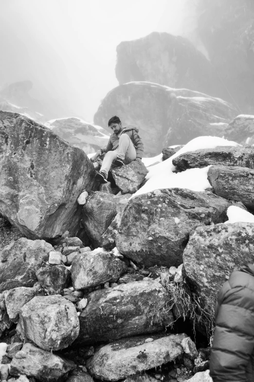 the man is taking a break from hiking