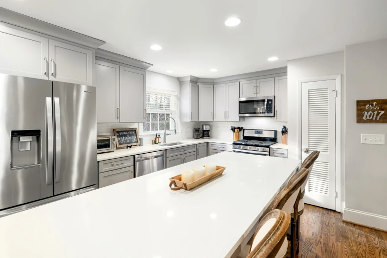 the modern kitchen has an island countertop with a  board