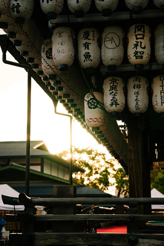 several lanterns with asian writing on them