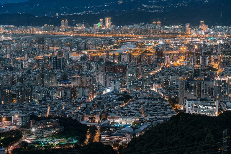 a cityscape shows light on the buildings below