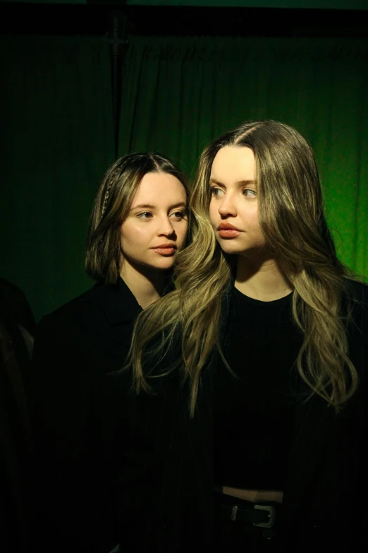 a couple of women standing next to each other