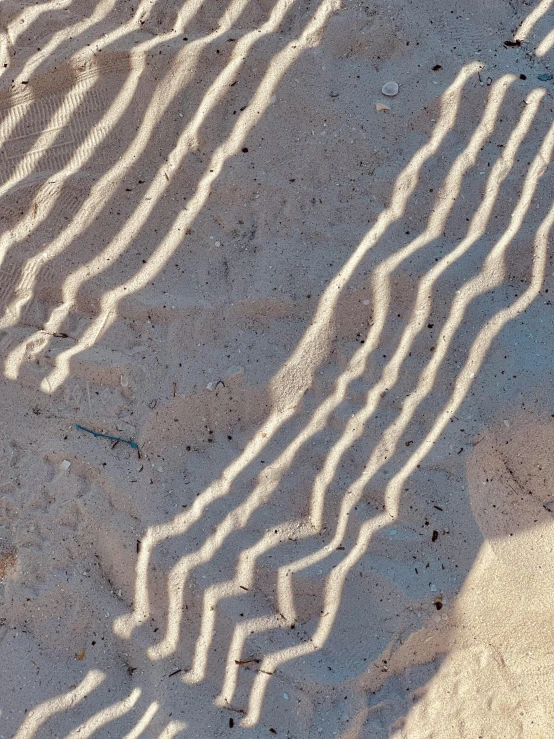 the shadow of a wave on the sand