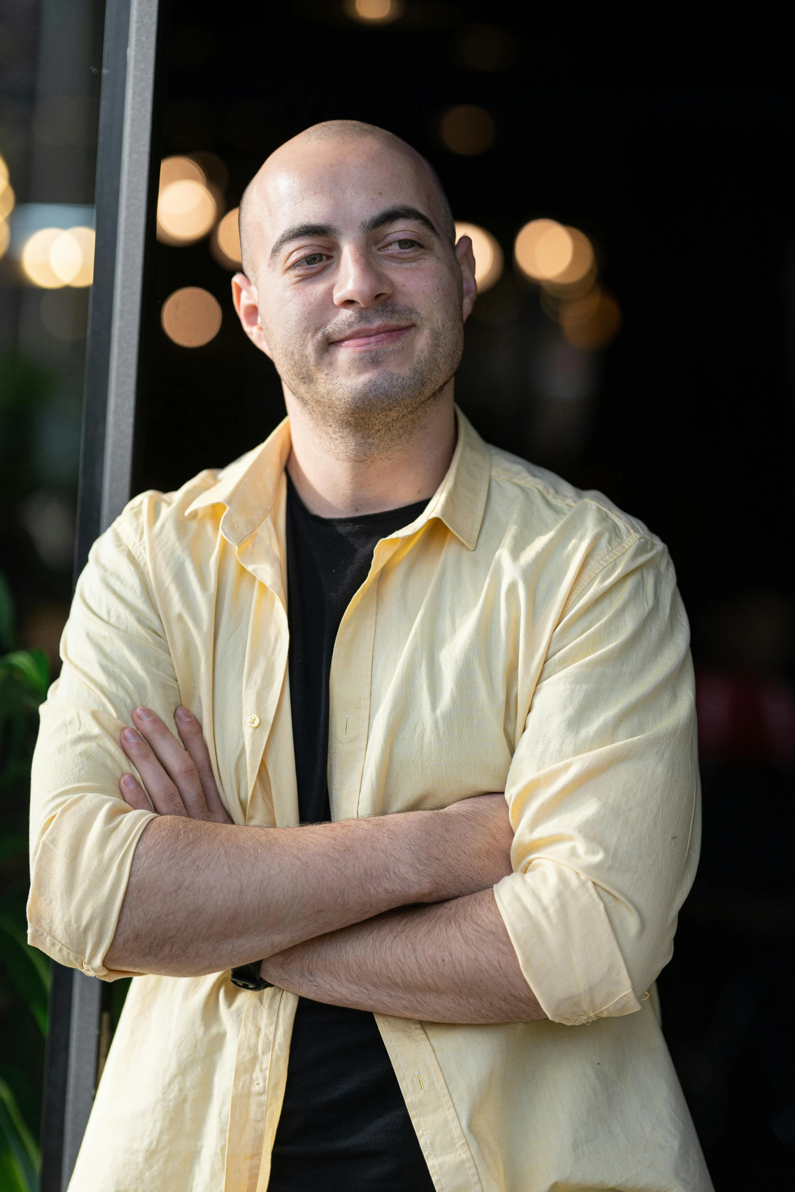 a man is standing in front of an open door