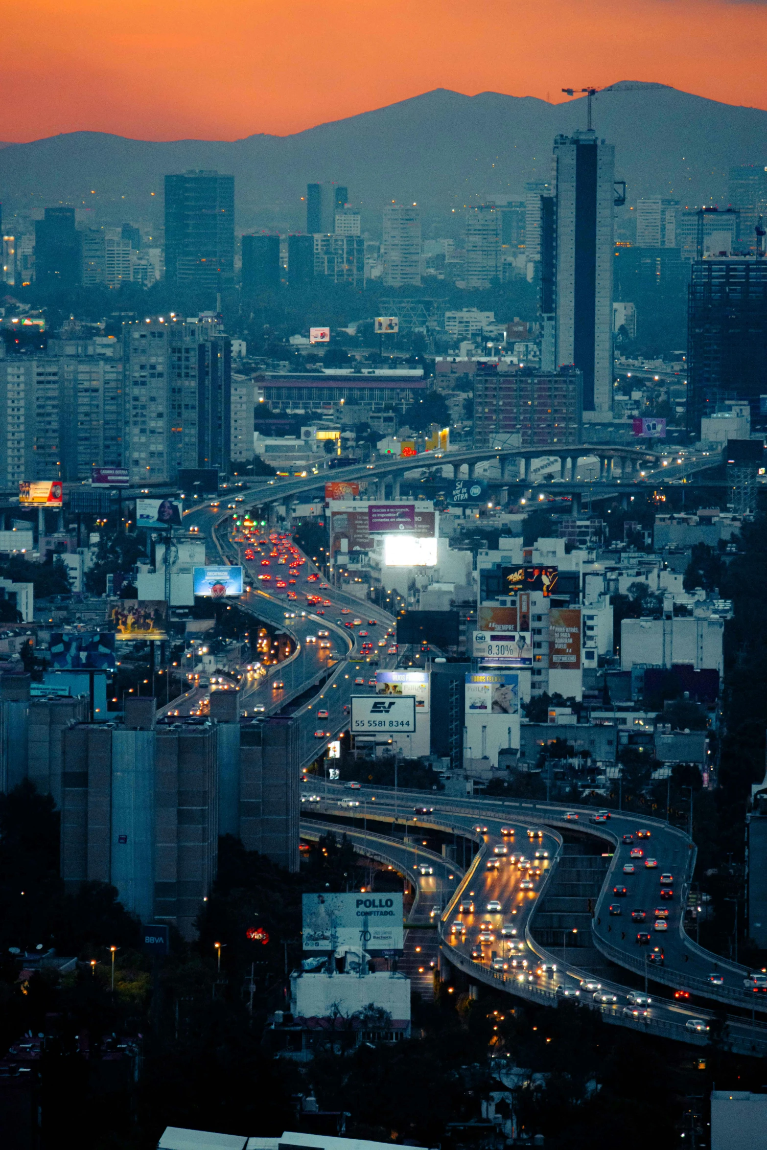 an image of city traffic in the evening