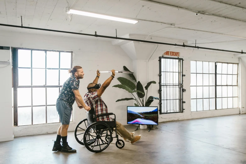 two men are playing with an interactive video game