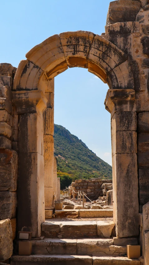 an archway between two stone columns is visible