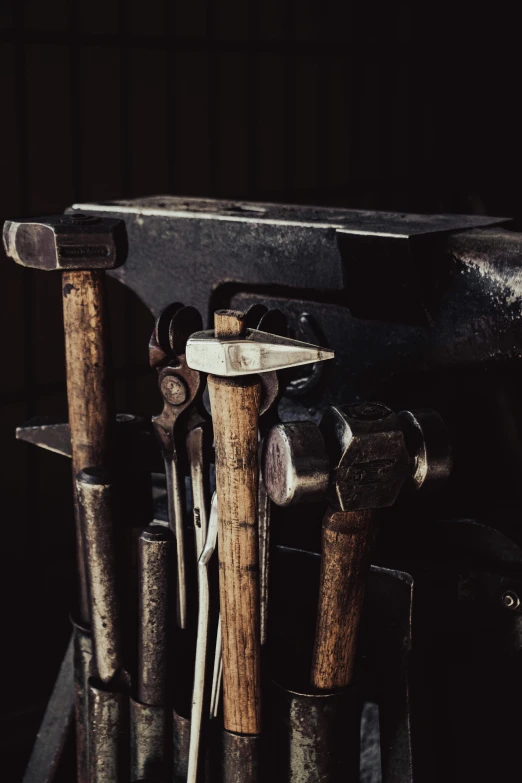 a bunch of wooden utensils lined up together