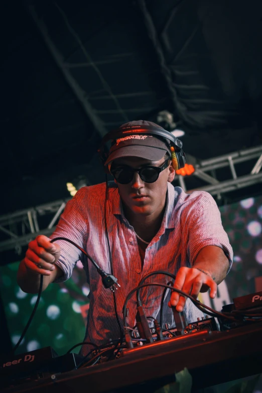 a man is mixing music at a festival