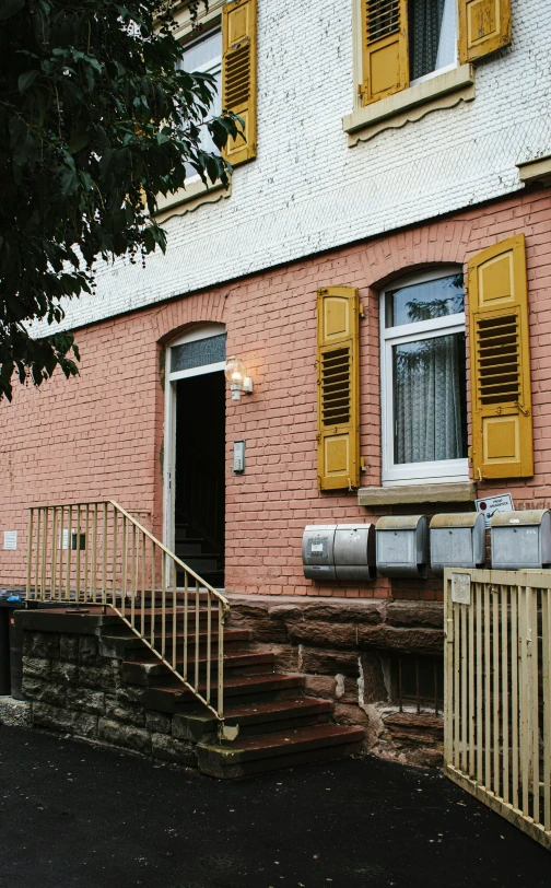 a building has a set of stairs that lead to two windows