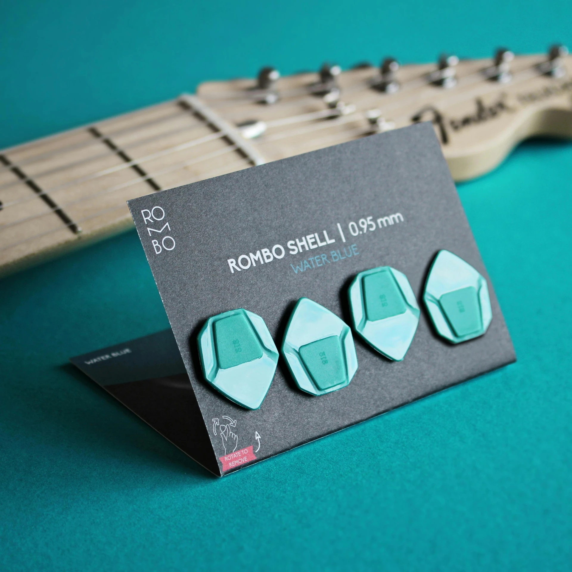 a guitar neck resting on a guitar card for an advertit