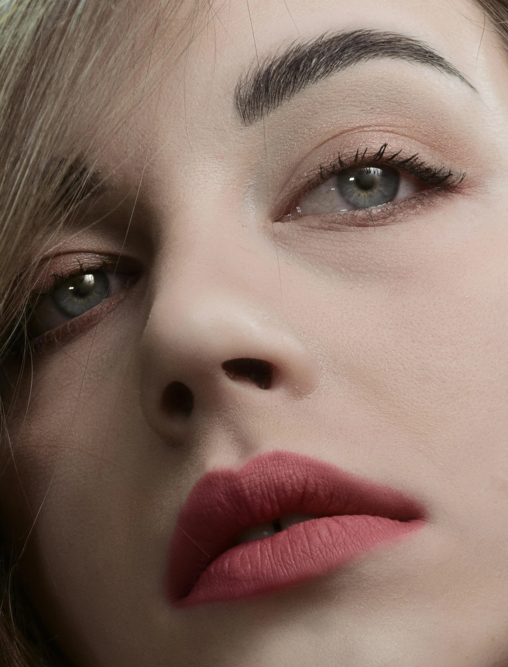 closeup on a beautiful young woman with red lipstick