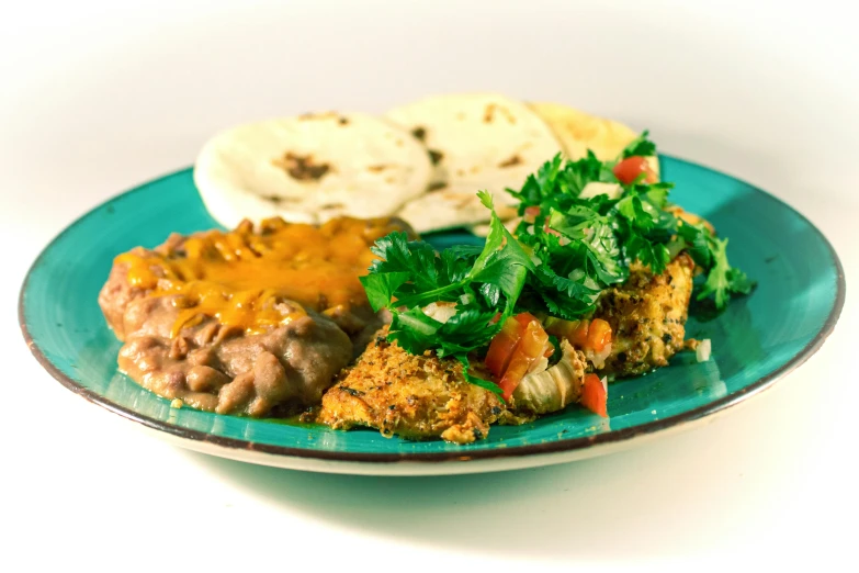 a green plate with an assortment of food on it