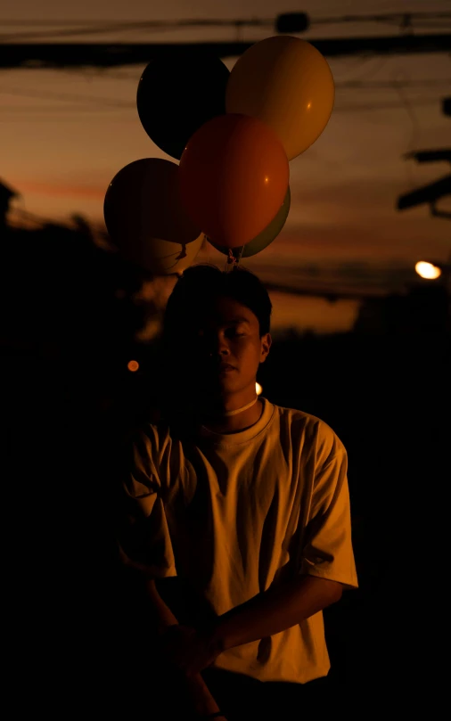  holding a bunch of balloons in the air