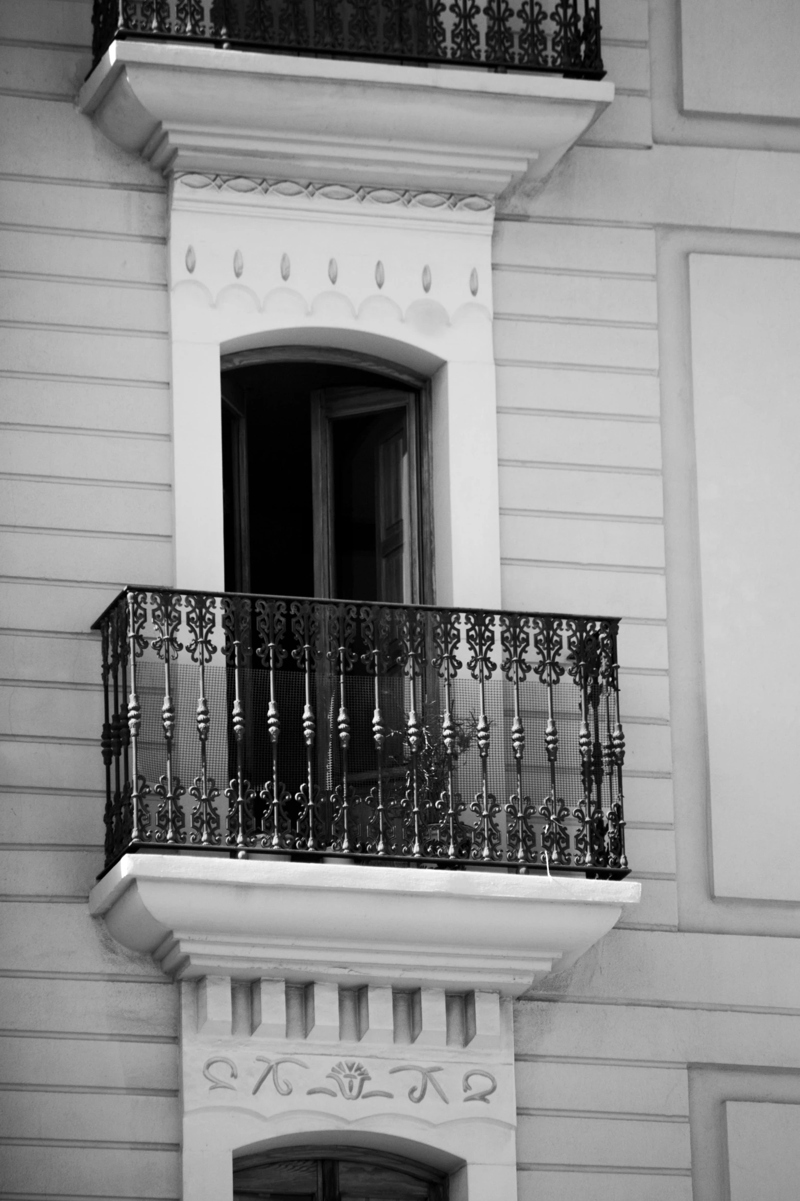 black and white pograph of a balcony with balconies