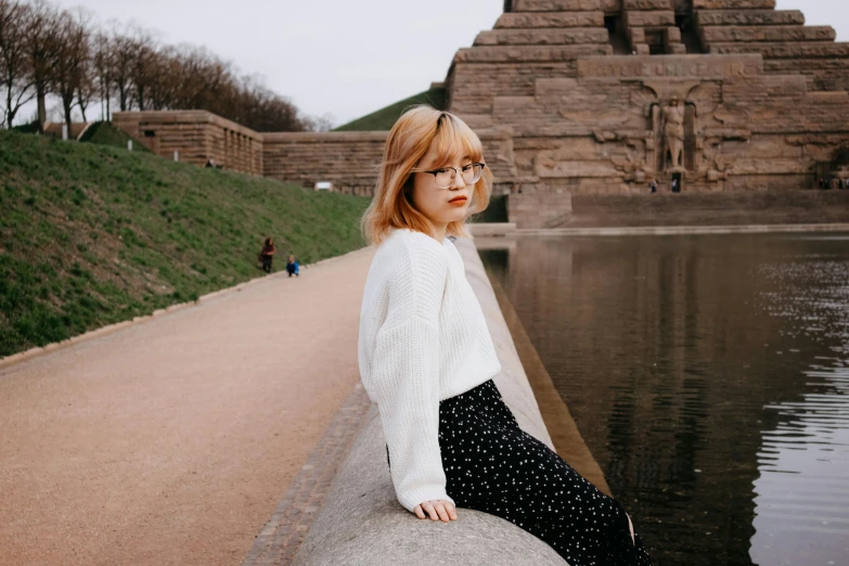 an image of a woman looking over a ledge