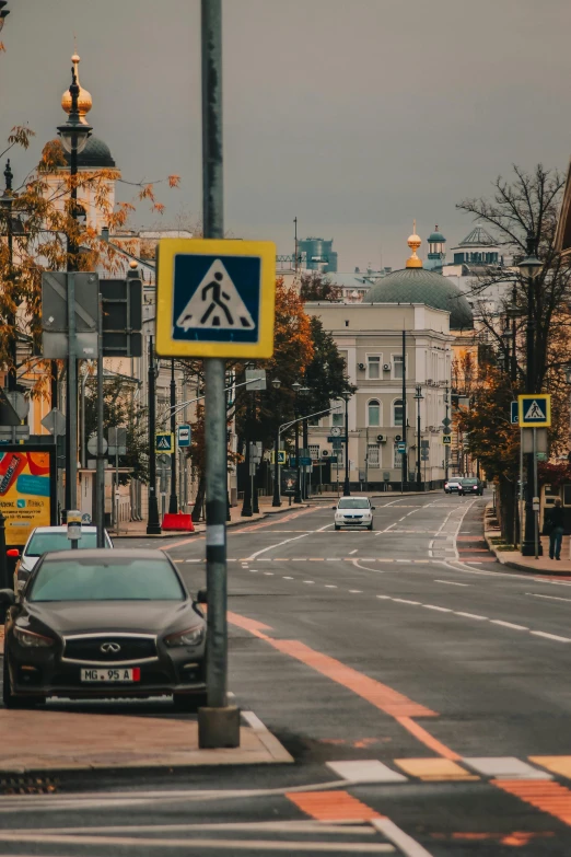 a car driving down a road in front of a city