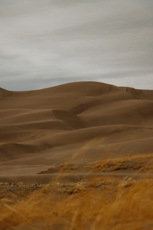 a lonely house sits atop an empty desert