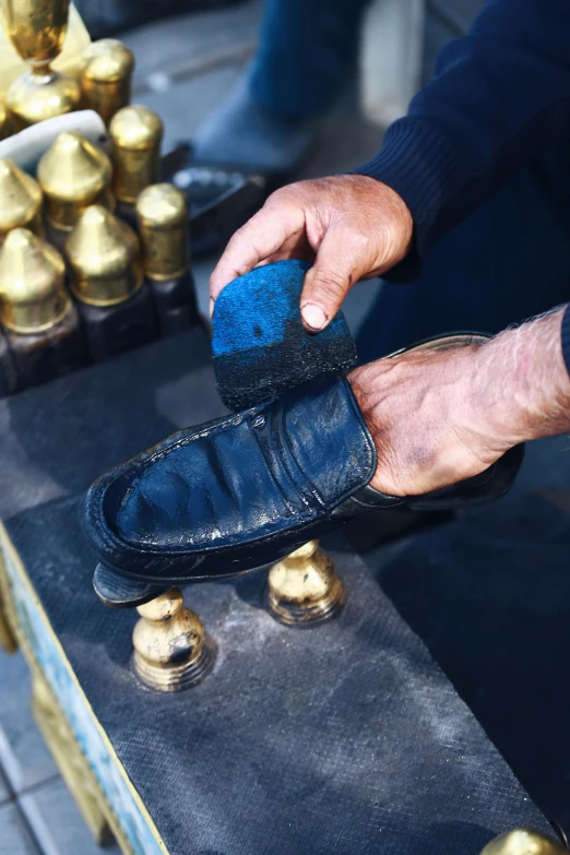 a person standing with their foot on a skate board