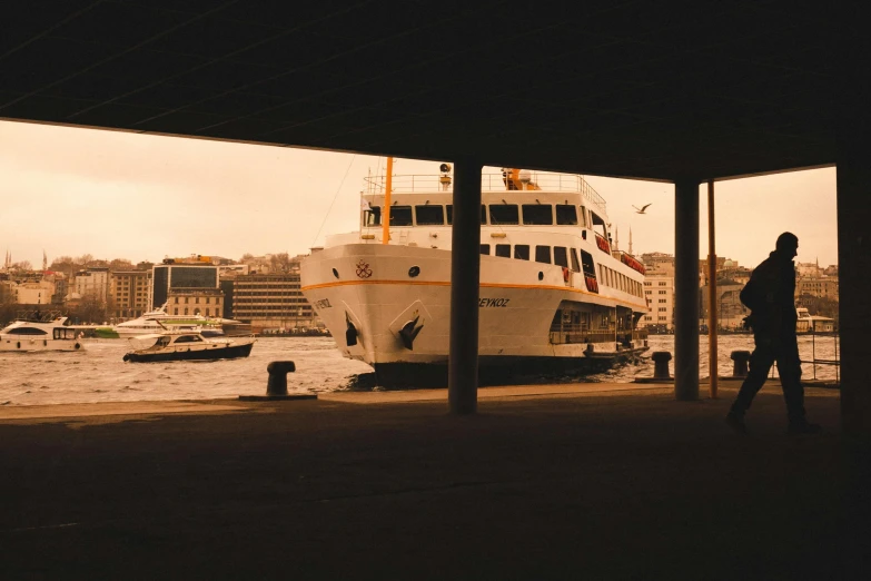 the ferry boat is going in to dock at the harbor