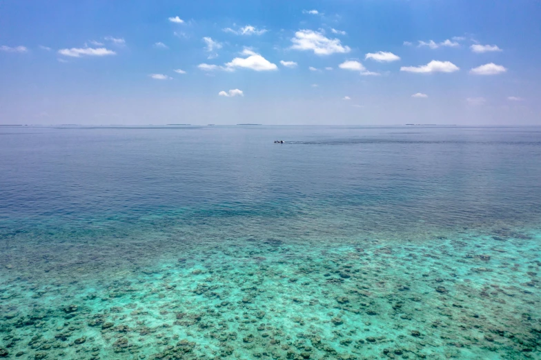 a large body of water with a boat in it