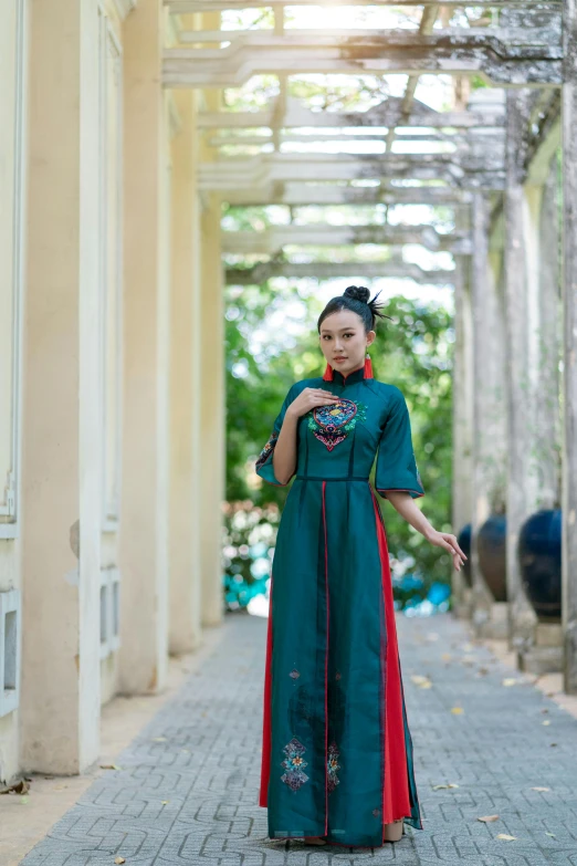 an asian girl poses in an old building