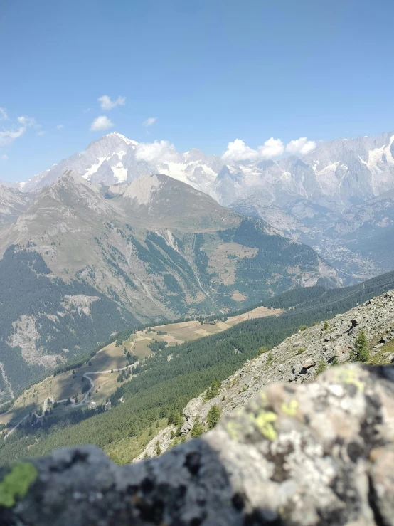 mountains and valleys are shown in the foreground