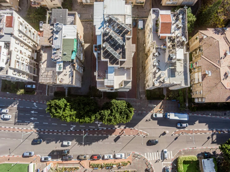 a picture looking down on two buildings and parking