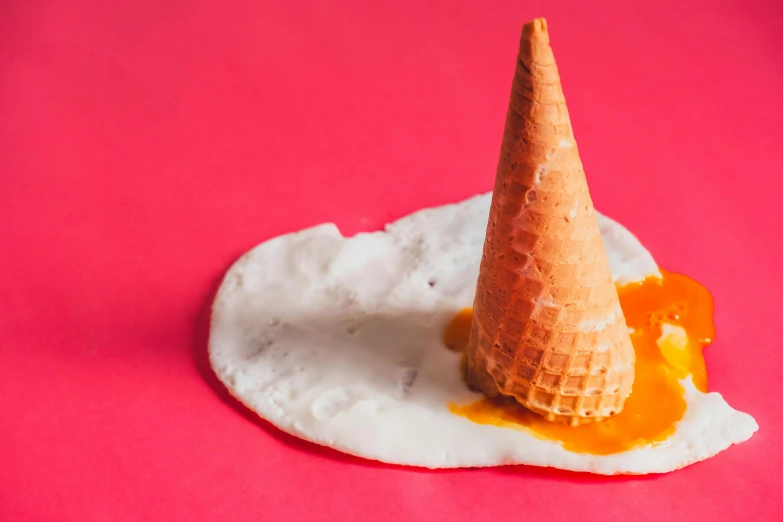 there is a cone on top of a egg