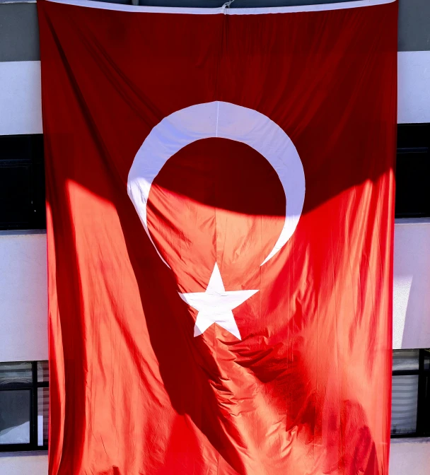 a flag in the shape of a crescent and a star