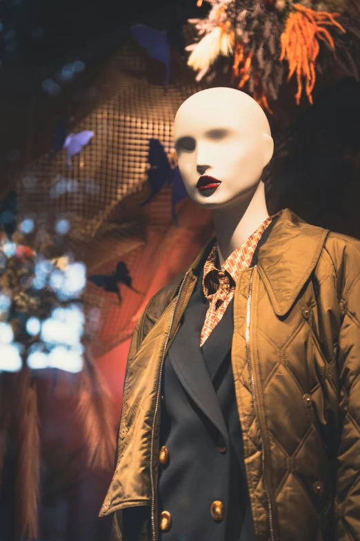 a mannequin dressed in a suit with a shirt and tie