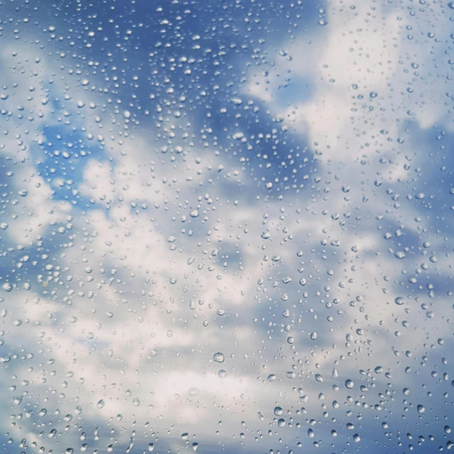 a window with a cloudy sky and some clouds