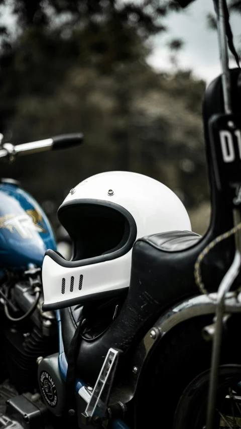 a helmet on the seat of a motorcycle