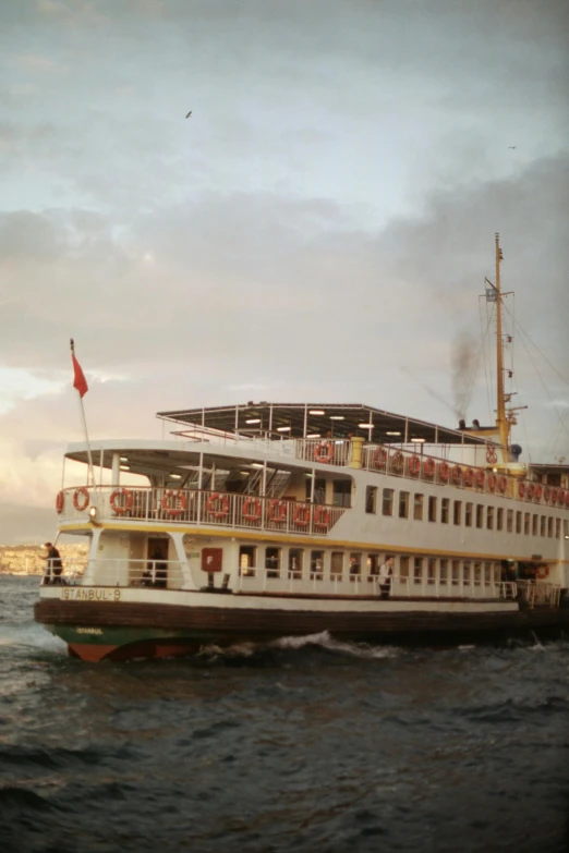 an old ship is sitting on the water