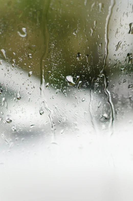 a window with rain drops on the glass