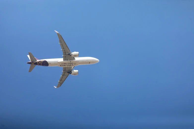 a plane flying overhead on a clear day