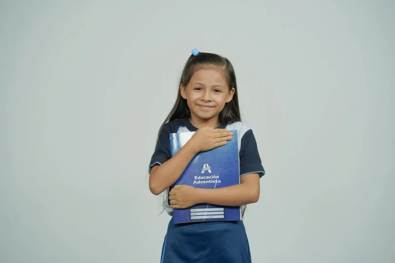 a  smiles as she holds an award