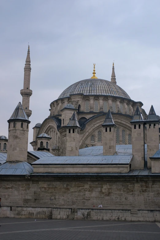 a church with two large towers next to a street