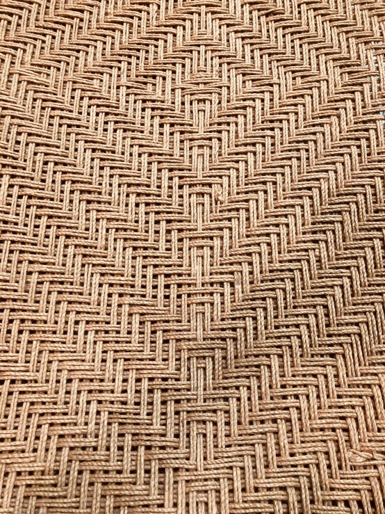 a woven brown surface with small lines