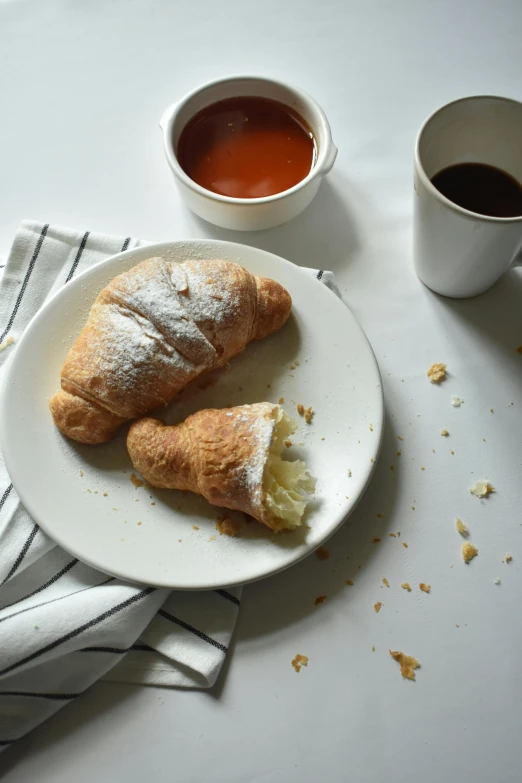 a close up of two pastry on a plate