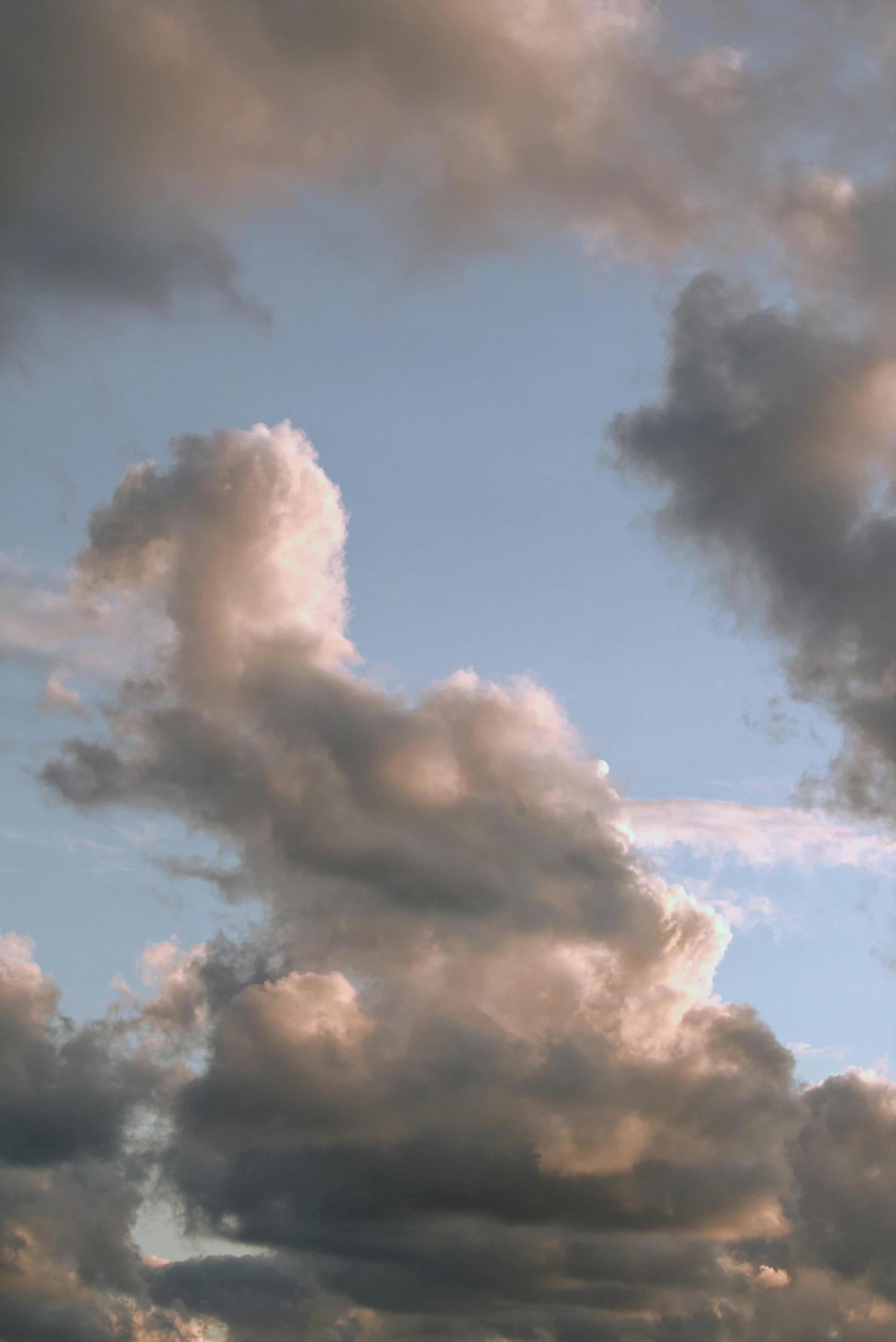 the sky is covered in grey clouds during a very pretty day