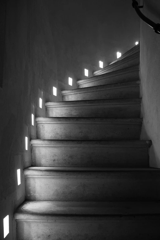 some white steps that are lit up with lights