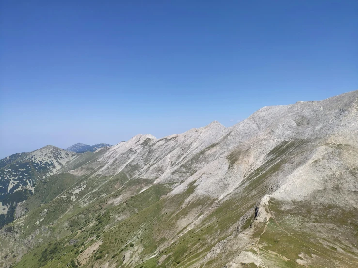 an aerial s of the mountains and trees