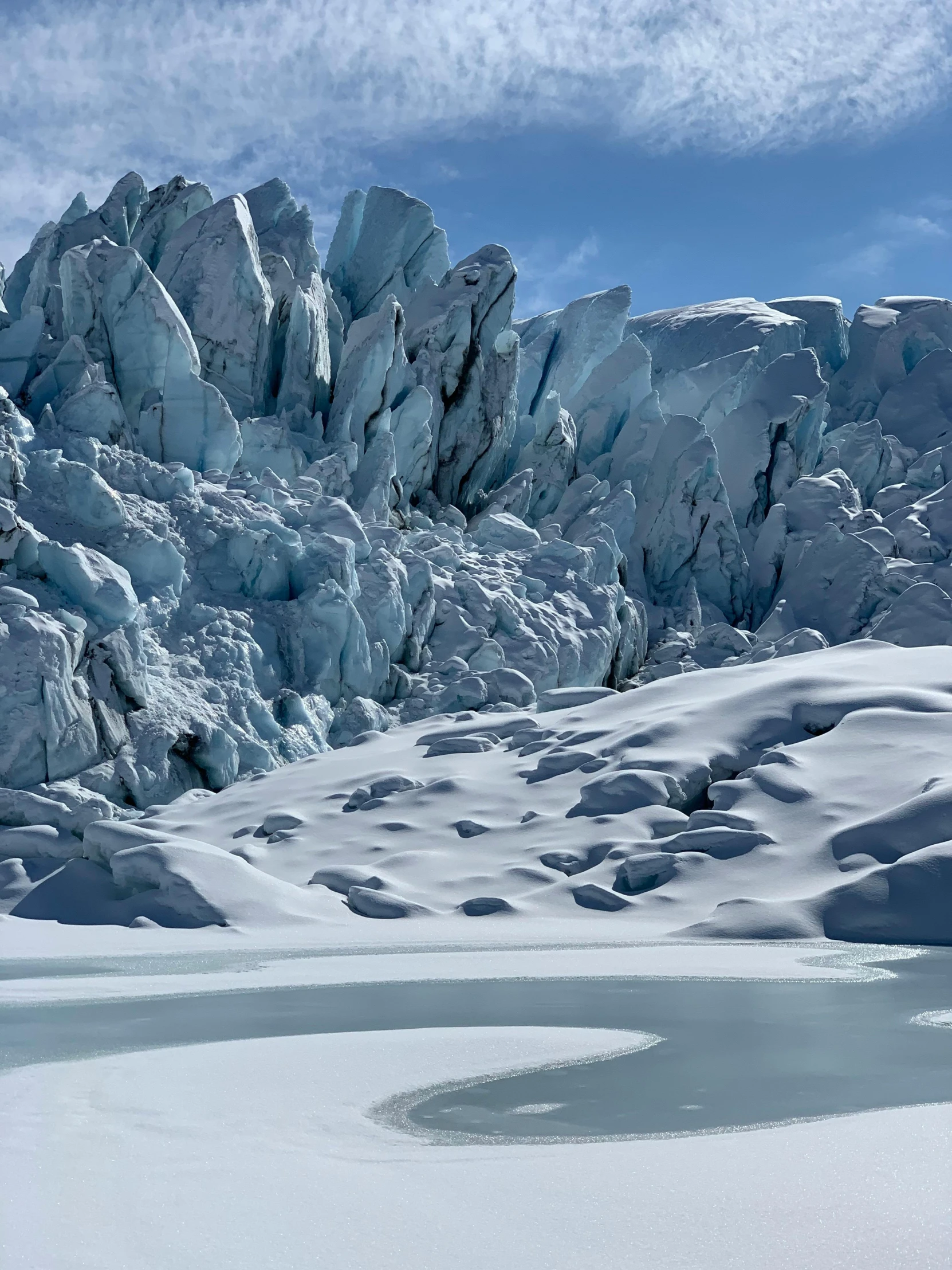 a person on a snow covered hill in the mountains