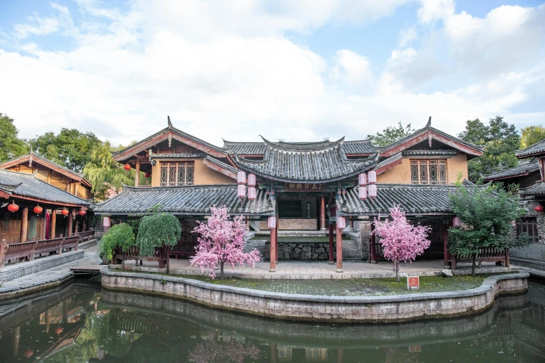 the buildings in the park are decorated with pink blossoms