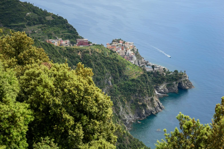 a view of the coast and mountains with houses on them