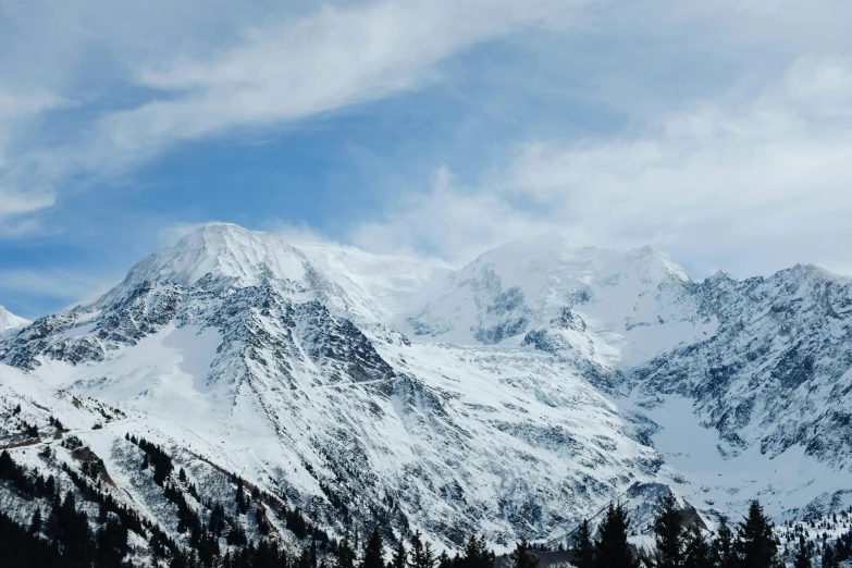 a snowy mountain on a bright day with snow and a blue sky