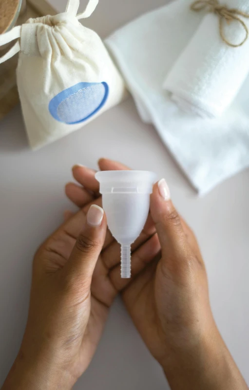 an unmade baby bottle sits between two towel