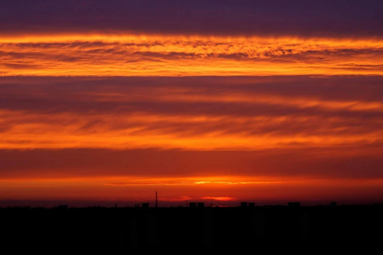 the sky is very colorful during this sunset